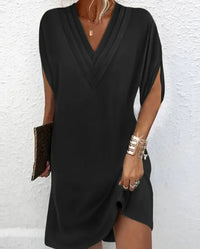 Elegante vestido liso con mangas con aberturas