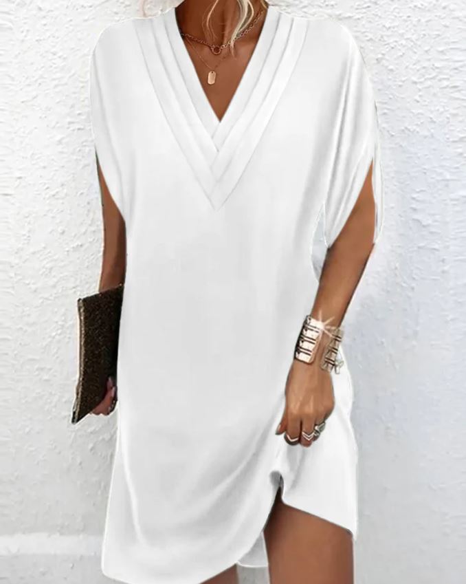 Elegante vestido liso con mangas con aberturas