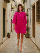 Elegante minivestido de manga media con flecos