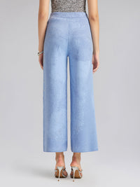 Pantalones elásticos de lana con pedrería