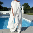 Conjunto de top y pantalón con hombros descubiertos en color liso